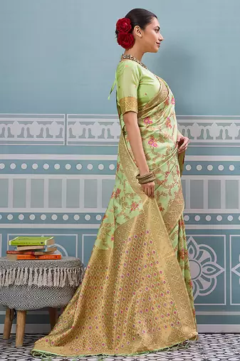 Light pistachio green banarasi silk blend saree with rich gold zari floral weaving
