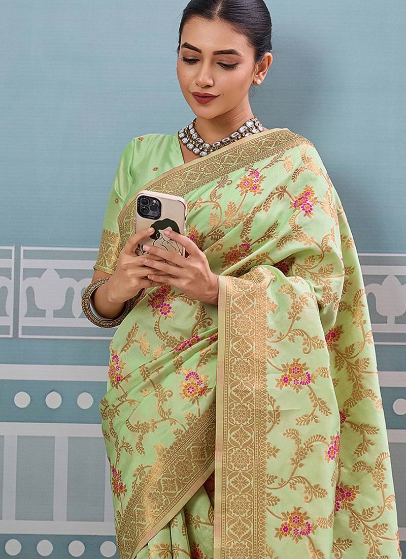 Light pistachio green banarasi silk blend saree with rich gold zari floral weaving