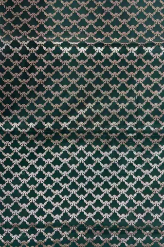 Bottle green semi kataan silk banarasi saree with beautiful floral booti zari work