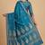 Teal blue semi kataan silk banarasi saree with floral zari work