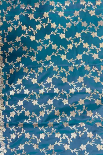 Teal blue semi kataan silk banarasi saree with floral zari work