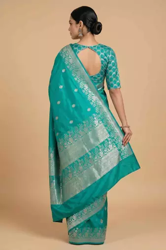 Turquoise semi kataan silk banarasi saree with silver zari booti work