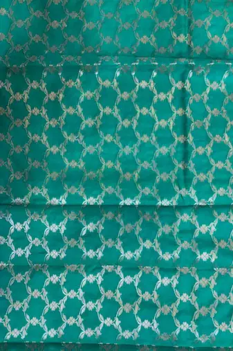 Turquoise semi kataan silk banarasi saree with silver zari booti work