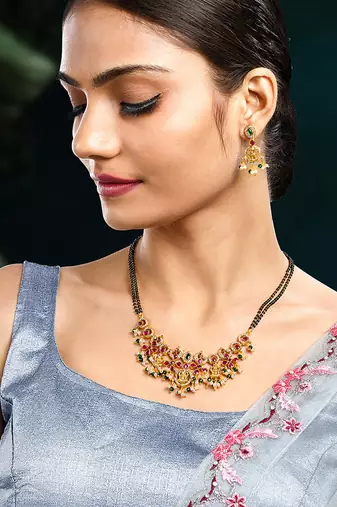Gold plated cubic zirconia synthetic stone & black beads studded mangalsutra & dangle earrings jewellery