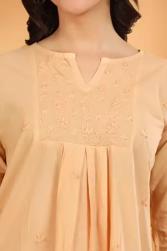 Women beige floral embroidered chikankari v neck pure cotton flared short kurtis