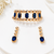 Gold-tone blue crystal choker necklace and earrings set