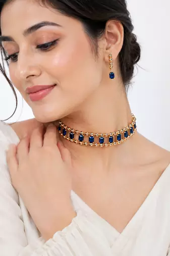 Gold-tone blue crystal choker necklace and earrings set