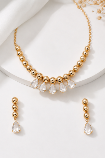 Gold-toned beaded necklace and earrings jewellery set with crystal drops