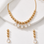 Gold-toned beaded necklace and earrings jewellery set with crystal drops