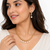 Gold-toned beaded necklace and earrings jewellery set with crystal drops