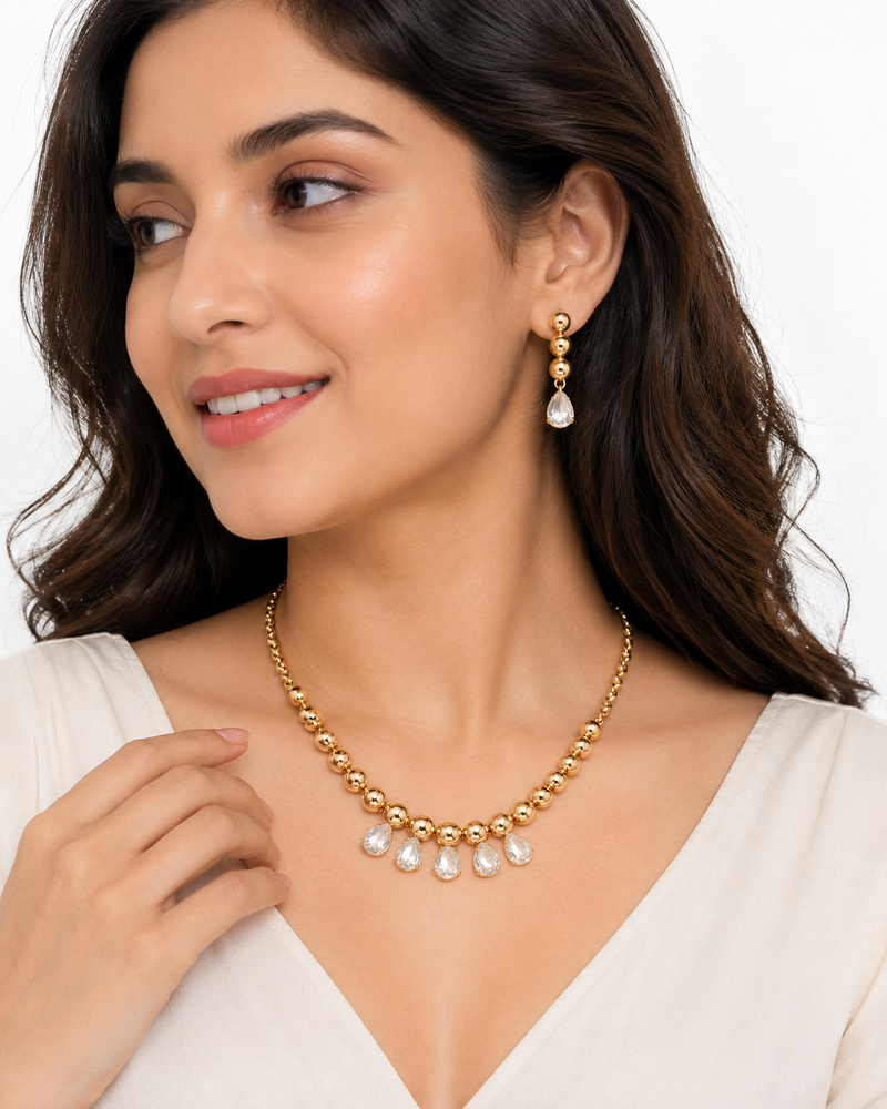 Gold-toned beaded necklace and earrings jewellery set with crystal drops