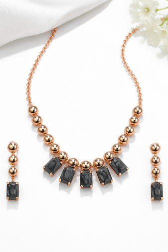 Rose gold necklace and earrings set with black crystal stones