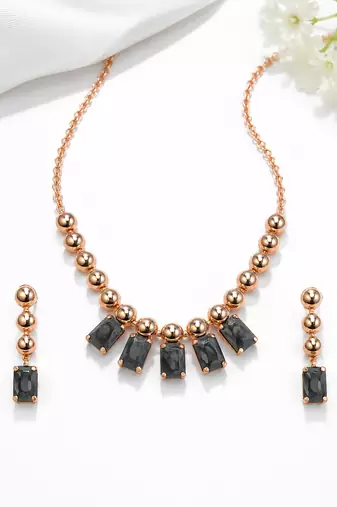Rose gold necklace and earrings set with black crystal stones