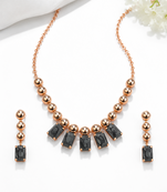 Rose gold necklace and earrings set with black crystal stones