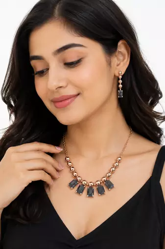 Rose gold necklace and earrings set with black crystal stones