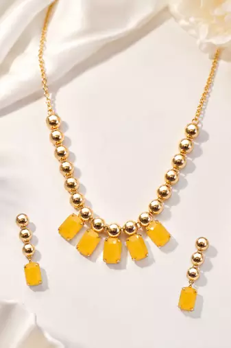 Gold-toned yellow stone necklace and earrings jewellery set
