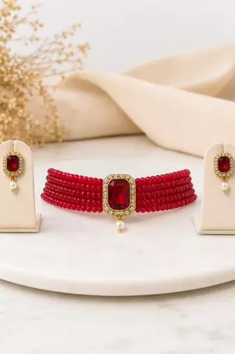 Red beaded choker necklace and earrings set with crystal pendant