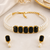 Pearl choker necklace set with black onyx stones, gold-toned