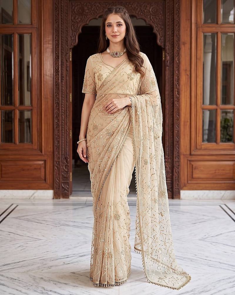 Cream designer net beads embroidery saree with unstitched blouse