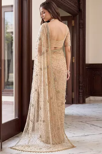 Cream designer net beads embroidery saree with unstitched blouse