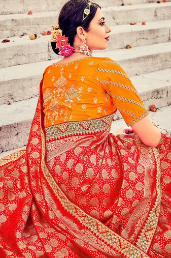 Red woven silk blend saree with blouse