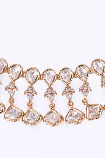 delightful oval shape uncut kundan stone 18 kt gold plated brass choker jewellery set for women
