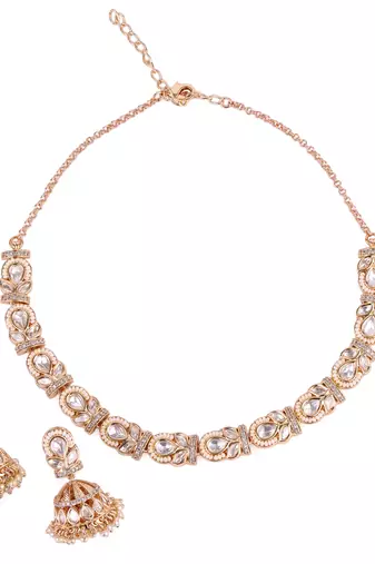 oval and leaf design uncut kundan stone 18 kt gold plated brass choker jewellery set for women