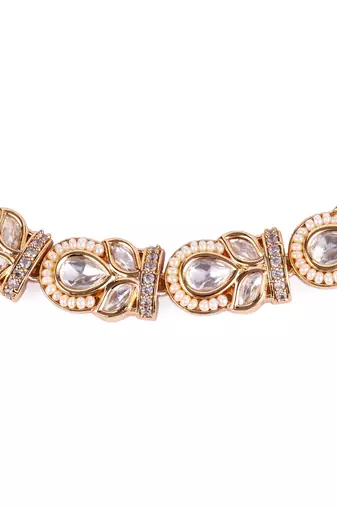 oval and leaf design uncut kundan stone 18 kt gold plated brass choker jewellery set for women
