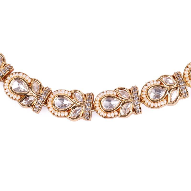 oval and leaf design uncut kundan stone 18 kt gold plated brass choker jewellery set for women