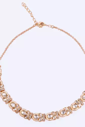 oval and leaf design uncut kundan stone 18 kt gold plated brass choker jewellery set for women