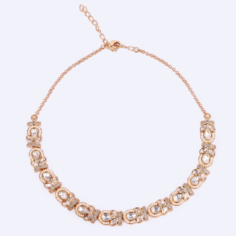oval and leaf design uncut kundan stone 18 kt gold plated brass choker jewellery set for women