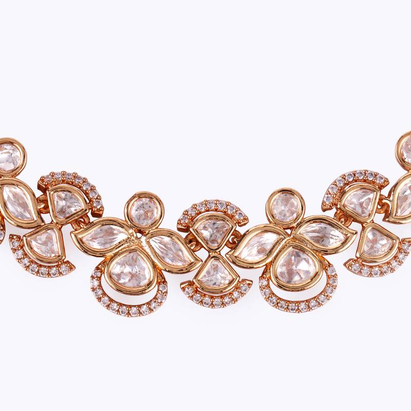 elegant leaf design uncut kundan stone 18 kt gold plated brass choker jewellery set for women