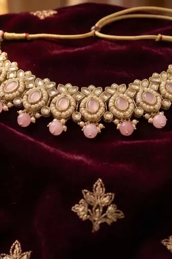 splendid oval and leaf shape pink pearl kundan gold plated choker jewellery set for women
