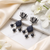 Oxidized silver lotus carved drop earrings with black beads & pearls