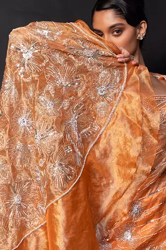 Saffron orange embroidered tissue drape saree set