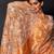Saffron orange embroidered tissue drape saree set