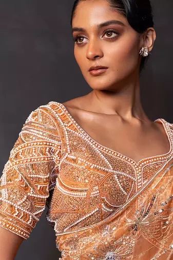 Saffron orange embroidered tissue drape saree set