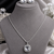 Rhodium finish crown radiance necklace set