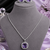 Rhodium finish radiance crest necklace set