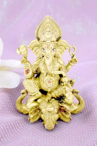 traditional god ganesha sitting on elephant brass gold plated idol(murti)