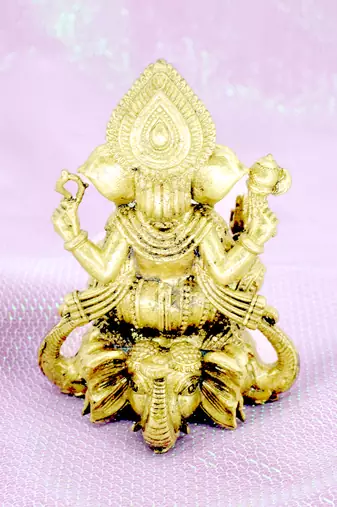 traditional god ganesha sitting on elephant brass gold plated idol(murti)
