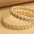 traditional oval shape pearl white kundan stone gold plated set of 2 bangle set for women