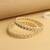 traditional oval shape pearl white kundan stone gold plated set of 2 bangle set for women