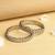 trendy oval shape white kundan stone antique gold plated set of 2 bangle set for women