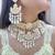 white kundan choker set with maang tikka
