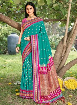Teal & rani pink banarasi silk blend saree with zari woven border 1