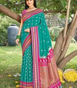 Teal & rani pink banarasi silk blend saree with zari woven border