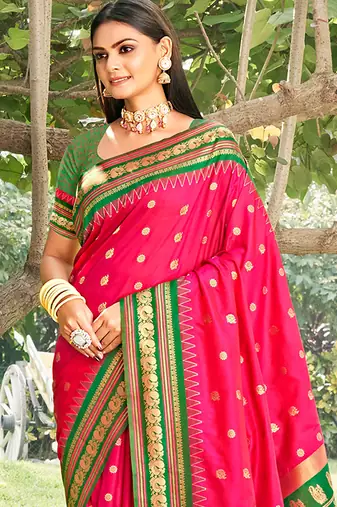 Rani pink & green banarasi silk blend saree with zari woven border
