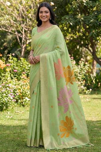 Pastel green linen cotton blend saree with floral woven pallu & zari border