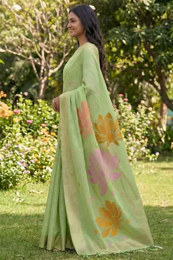 Pastel green linen cotton blend saree with floral woven pallu & zari border